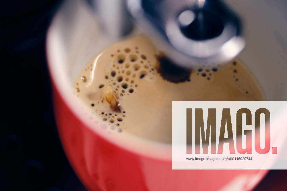 Vienna, Austria April 17, 2021 Red cup under a coffee machine is filled Vienna Vienna Austria