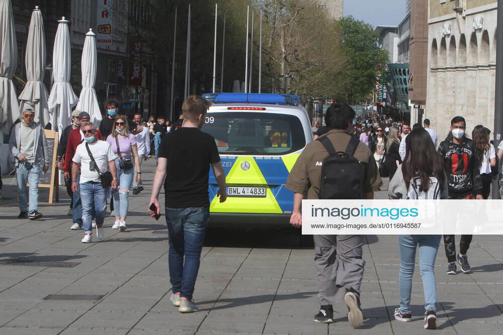 A police patrol of the state police Baden Württemberg controls the compliance with the minimum distances in the pedestrian zone and shopping street Königstraße in the city centre of Stuttgart, Baden Württemberg, Bavaria, Germany