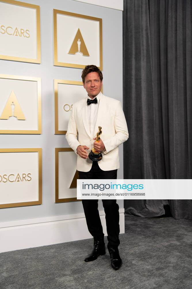 On behalf of Denmark, Thomas Vinterberg poses backstage with the Oscar for International Feature Film during the live ABC Telecast of The 93rd Oscars at Union Station in Los Angeles. Los Angeles USA - ZUMAz03_ 20210425_sso_z03_230