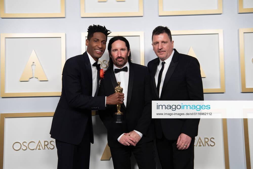 Jon Batiste, Trent Reznor, and Atticus Ross accept the Oscar for Original Score during the live ABC Telecast of The 93rd Oscars at Union Station in Los Angeles. Los Angeles USA - ZUMAz03_ 20210425_sso_z03_205