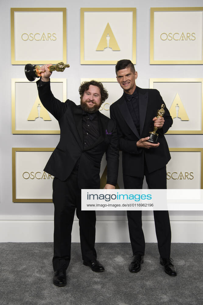 Michael Govier and Will McCormack pose backstage with the Oscar for Animated Short Film during the live ABC Telecast of The 93rd Oscars at Union Station in Los Angeles. Los Angeles USA - ZUMAz03_ 20210425_sso_z03_222