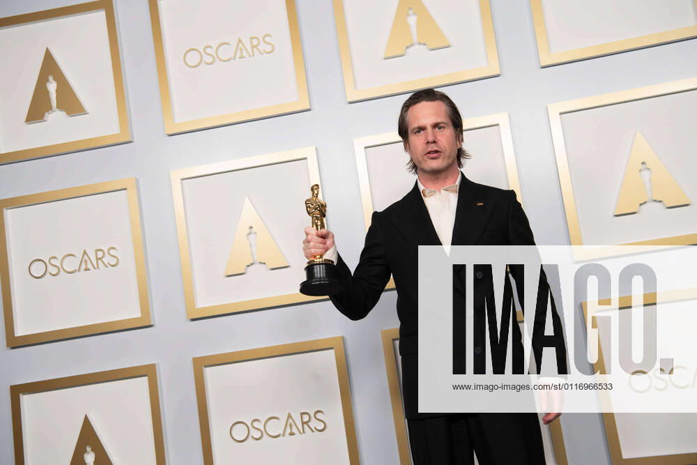 Mikkel E. G. Nielsen poses backstage with the Oscars for Film Editing during the live ABC Telecast of The 93rd Oscars at Union Station in Los Angeles, CA on Sunday, April 25, 2021. Los Angeles CA USA