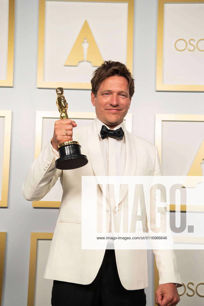 On behalf of Denmark, Thomas Vinterberg poses backstage with the Oscars for International Feature Film during the live ABC Telecast of The 93rd Oscars at Union Station in Los Angeles, CA on Sunday, April 25, 2021. Los Angeles CA USA