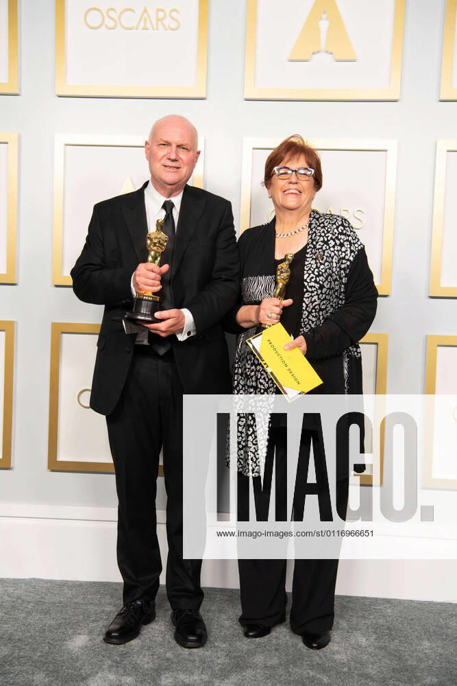 Donald Graham and Jan Pascale pose backstage with the Oscars for Production Design during the live ABC Telecast of The 93rd Oscars at Union Station in Los Angeles, CA on Sunday, April 25, 2021. Los Angeles CA USA