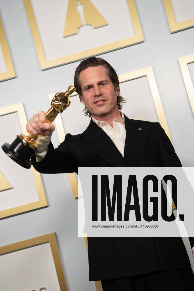 Mikkel E. G. Nielsen poses backstage with the Oscars for Film Editing during the live ABC Telecast of The 93rd Oscars at Union Station in Los Angeles, CA on Sunday, April 25, 2021. Los Angeles CA USA