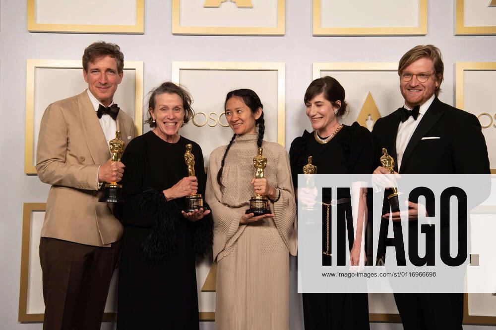 Peter Spears, Frances McDormand, Chloe Zhao, Mollye Asher, and Dan Janvey pose backstage with the Oscars for Best Picture during the live ABC Telecast of The 93rd Oscars at Union Station in Los Angeles, CA on Sunday, April 25, 2021. Los Angeles CA USA