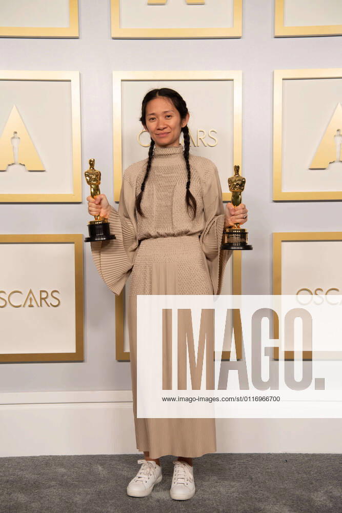 Chloe Zhao poses backstage with the Oscars for Directing during the live ABC Telecast of The 93rd Oscars at Union Station in Los Angeles, CA on Sunday, April 25, 2021. Los Angeles CA USA