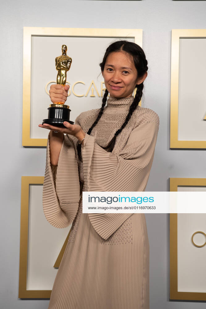 CHLOE ZHAO poses backstage with the Oscar for Directing during the live ABC Telecast of The 93rd Oscars at Union Station. Los Angeles USA - ZUMAz03_ 20210425_sso_z03_209