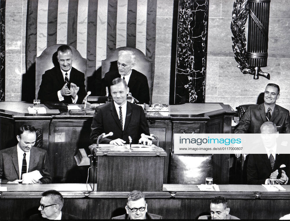 Washington, DC - (FILE) -- Astronaut Neil Armstrong displays his boyish grim as he shares the rostrum in the United States House of Representatives with fellow lunar travelers Michael Collins, left, and Edwin E. Buzz Aldrin, Jr., right, as they address a Joint Session of Congress on September 16, 1969. Armstrong s remarks enjoyed the applause of Vice President Spiro Agnew, left rear, and Speaker of the House John McCormick (Democrat of Massachusetts), rear right Washington USA - ZUMAs152 20090414_zaa_s152_001