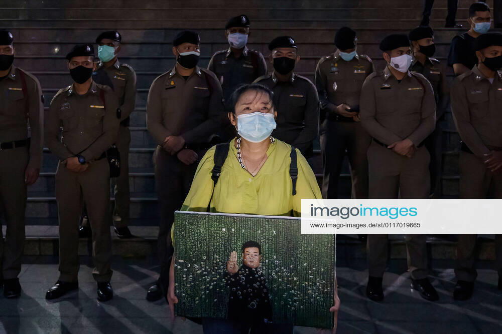 Sureerat Chiwarak holding a portrait of her son, Parit following the denial of bail requests of all 7 detained protestors, including Penguin who is on his 45th day of hunger strike..Parit Penguin Chiwaraks condition worsens and other 6 pro-democracy leaders as they remain in custody for lesse-majeste law aka article 112 at the Criminal Court that saw no reason to change its previous orders. Bangkok Thailand - ZUMAs197 20210429_zaa_s197_136