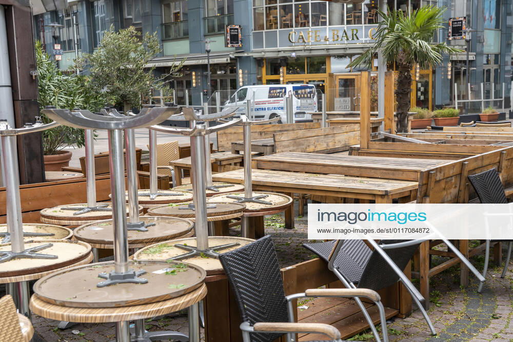 Stacked chairs and tables of various gastronomy businesses, on Kennedyplatz, closed cafes, pubs, restaurants, effects of the Corona Lockdown in Essen, NRW, Germany, Corona Lockdown