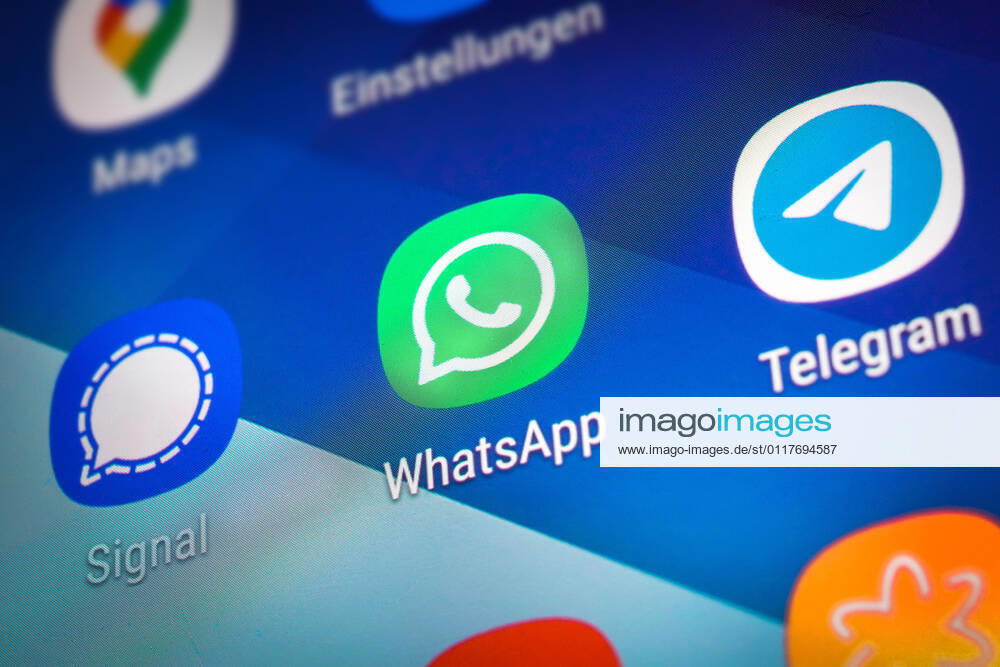 Logos of the social media messenger apps Telegram, WhatsApp and Signal on the screen of a smartphone