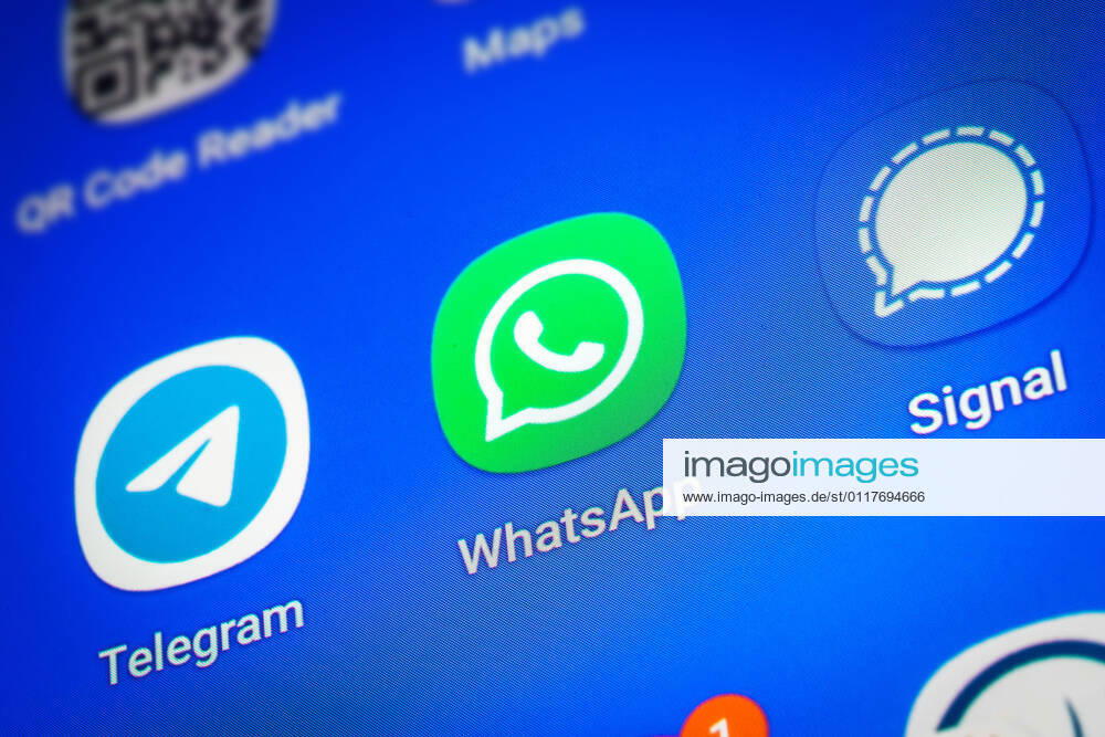 Logos of the social media messenger apps Telegram, WhatsApp and Signal on the screen of a smartphone
