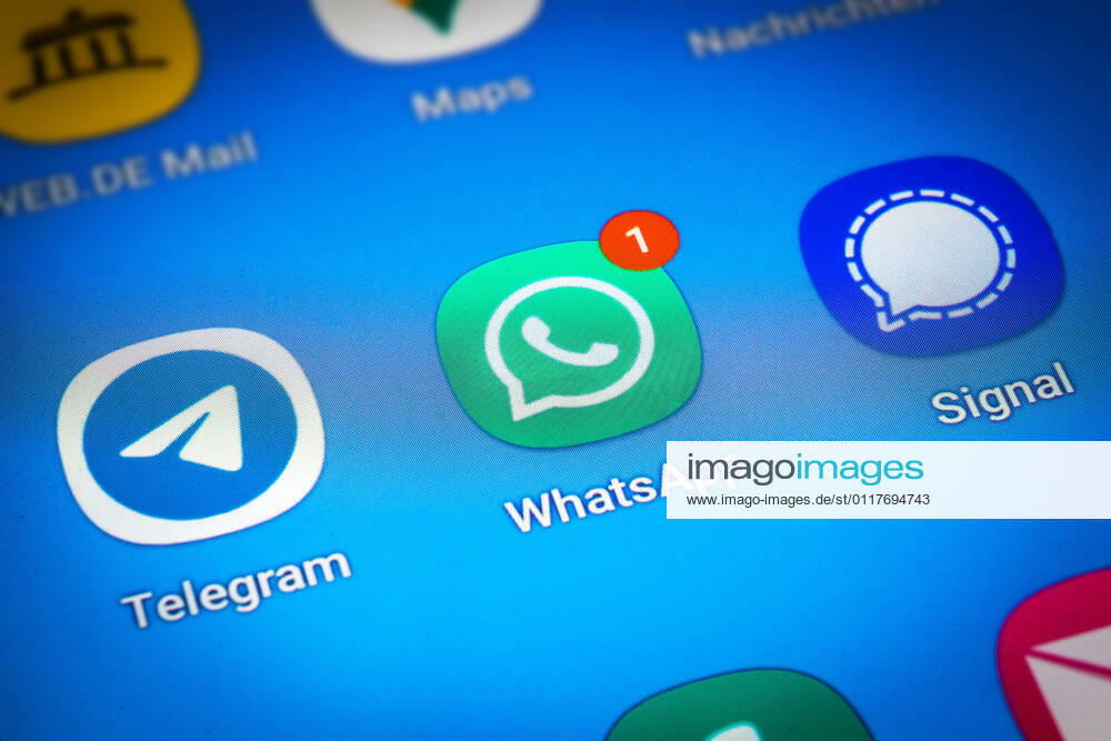 Logos of the social media messenger apps Telegram, WhatsApp and Signal on the screen of a smartphone