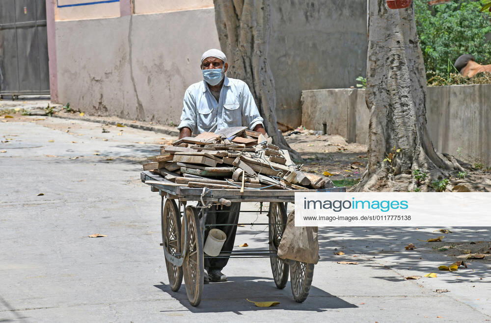 Cremation Of COVID-19 Victims In Rajasthan, India A worker pulls a handcart loaded with firewood for cremation of COVID-19 victim at Hindu Moksha Dham Crematorium in Beawar. Beawar Rajasthan India