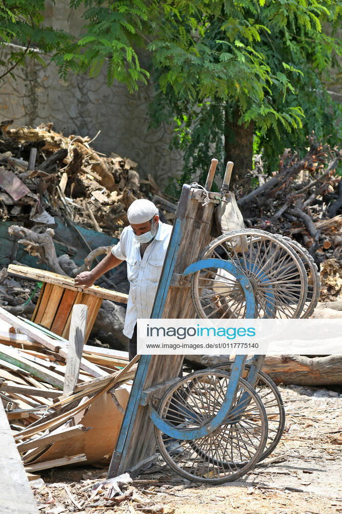 Cremation Of COVID-19 Victims In Rajasthan, India A worker pulls a handcart loaded with firewood for cremation of COVID-19 victim at Hindu Moksha Dham Crematorium in Beawar. Beawar Rajasthan India