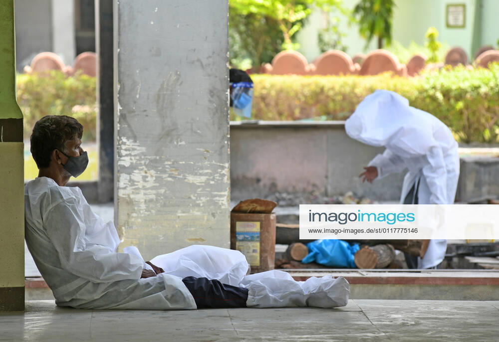 Cremation Of COVID-19 Victims In Rajasthan, India A family member mourn the death of COVID-19 victim before cremation at Hindu Moksha Dham crematorium, amid coronavirus pandemic in Beawar. Beawar Rajasthan India