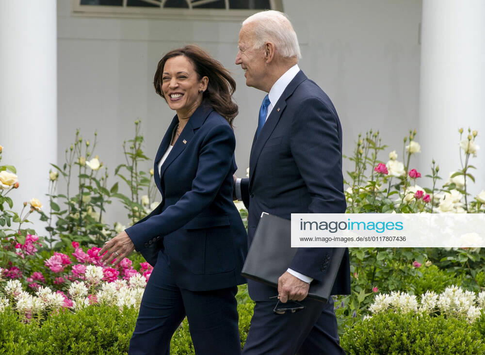 United States Vice President Kamala Harris and US President Joe Biden walk away after he gave remarks on the new Covid-19 Centers for Disease Control mask guidelines in the Rose Garden, at the White House in Washington, DC on Thursday, May 13, 2021. Fully vaccinated people no longer need to wear a face mask or stay six feet away from others in most settings, whether outdoors or indoors, the Centers for Disease Control and Prevention said in updated public health guidance released Thursday Washington USA - ZUMAs152 20210513_zaa_s152_210