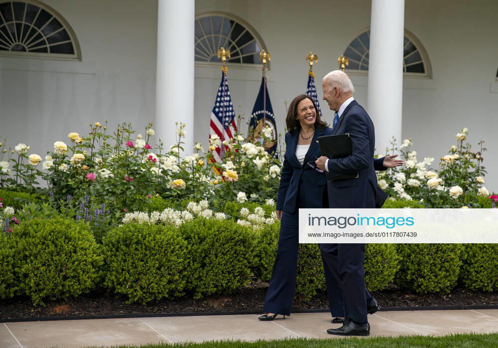 United States Vice President Kamala Harris and US President Joe Biden walk away after he gave remarks on the new Covid-19 Centers for Disease Control mask guidelines in the Rose Garden, at the White House in Washington, DC on Thursday, May 13, 2021. Fully vaccinated people no longer need to wear a face mask or stay six feet away from others in most settings, whether outdoors or indoors, the Centers for Disease Control and Prevention said in updated public health guidance released Thursday Washington USA - ZUMAs152 20210513_zaa_s152_212