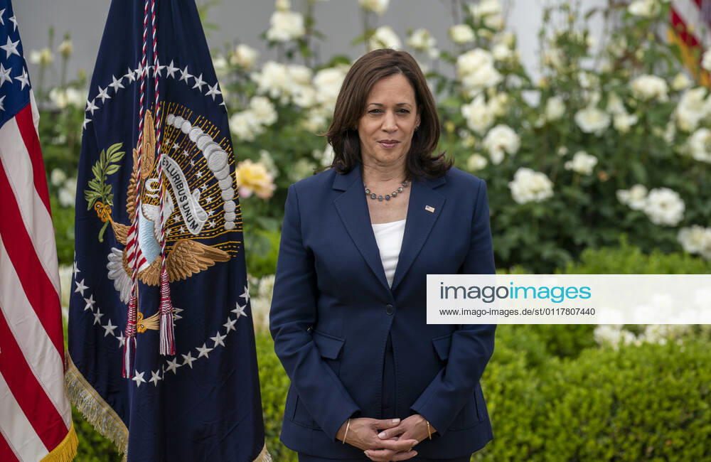 United States Vice President Kamala Harris listens to President Joe Biden gives remarks on the new Covid-19 Centers for Disease Control mask guidelines in the Rose Garden, at the White House in Washington, DC on Thursday, May 13, 2021. Fully vaccinated people no longer need to wear a face mask or stay six feet away from others in most settings, whether outdoors or indoors, the Centers for Disease Control and Prevention said in updated public health guidance released Thursday Washington USA - ZUMAs152 20210513_zaa_s152_214