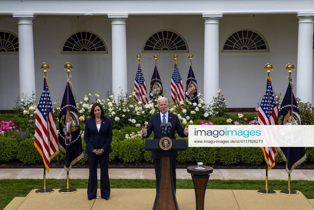 United States President Joe Biden gives remarks on the new Covid-19 Centers for Disease Control mask guidelines in the Rose Garden, at the White House in Washington, DC on Thursday, May 13, 2021. Fully vaccinated people no longer need to wear a face mask or stay six feet away from others in most settings, whether outdoors or indoors, the Centers for Disease Control and Prevention said in updated public health guidance released Thursday. US Vice President Kamala Harris stands at left.