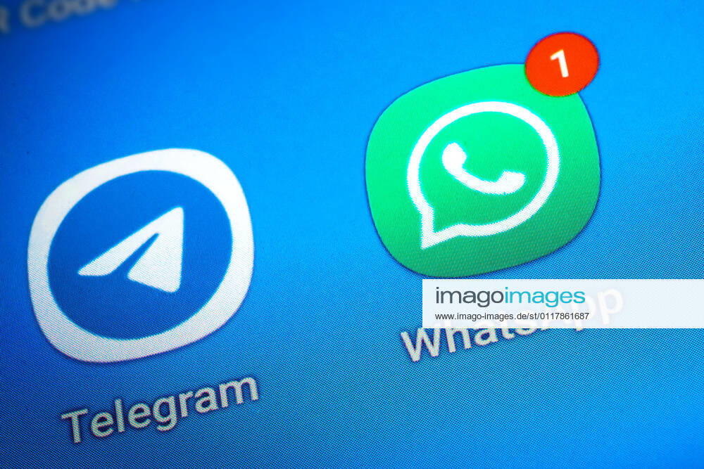 Logos of the social media messenger apps Telegram and WhatsApp on the screen of a smartphone