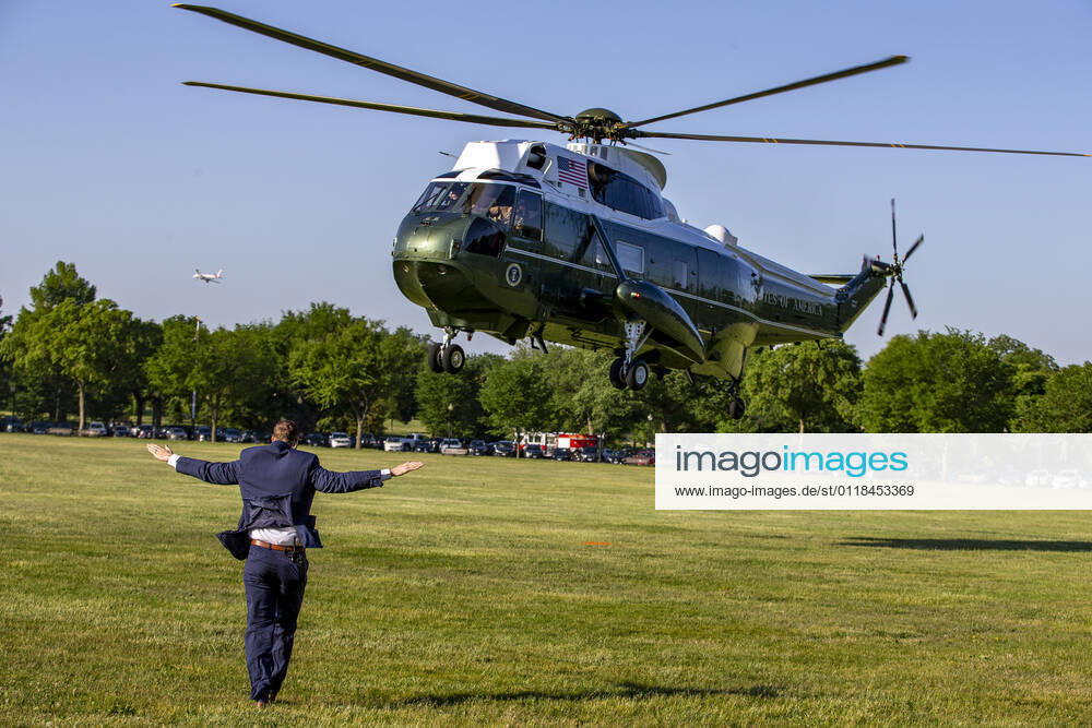 Ground Personal help land Marine One on the Ellipse to transport United States President Joe Biden at the White House in Washington, DC on Wednesday. President Joe Biden Departs White House for Connecticut for the US Coast Guard s 140th commencement. Washington USA - ZUMAs152 20210519_zaa_s152_003