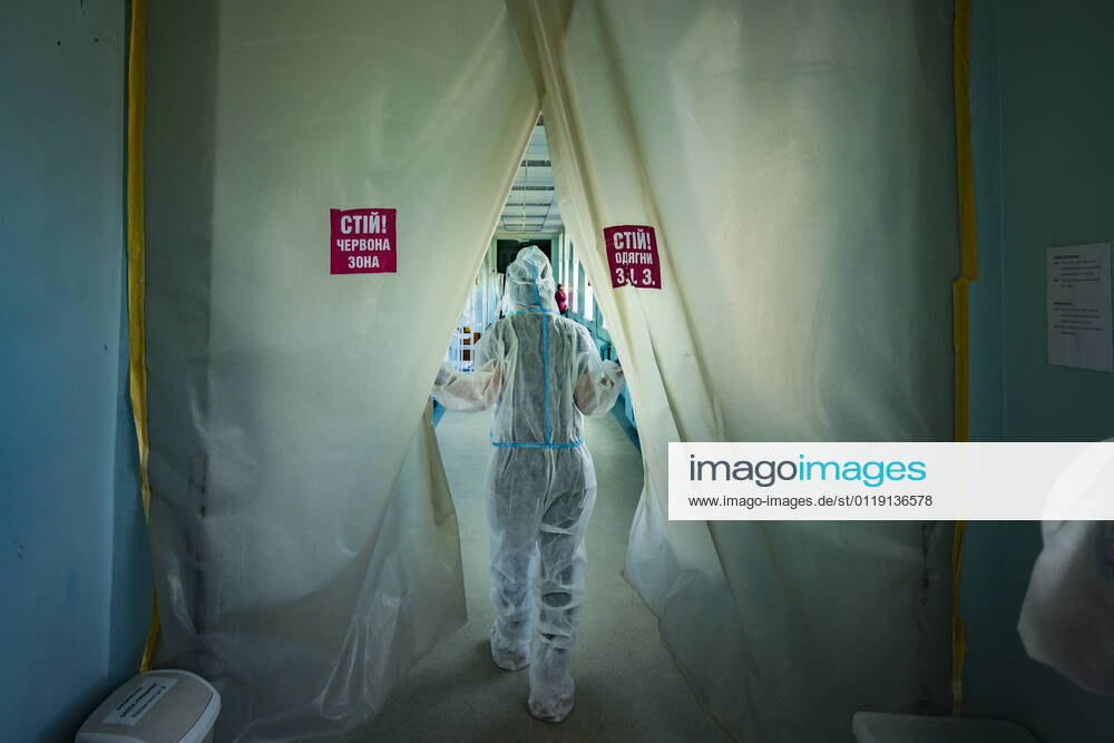 A health worker enters in an area with covid-19 patients with extreme situation in the intensive cares area of a hospital in Kiev, Ukraine. Banners in the plastic barrier say Stop! red zone Kiev Ukraine - ZUMAa131 20210525_zap_a131_003
