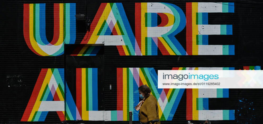 Daily Life In Dublin A woman walks past a mural with the words U ARE ALIVE , a collaboration project between two artists Maser and Aches, seen in the center of Dublin. On Wednesday, 26 May 2021, in Dublin, Ireland. Dublin Ireland widak-dublin210526_npFCj
