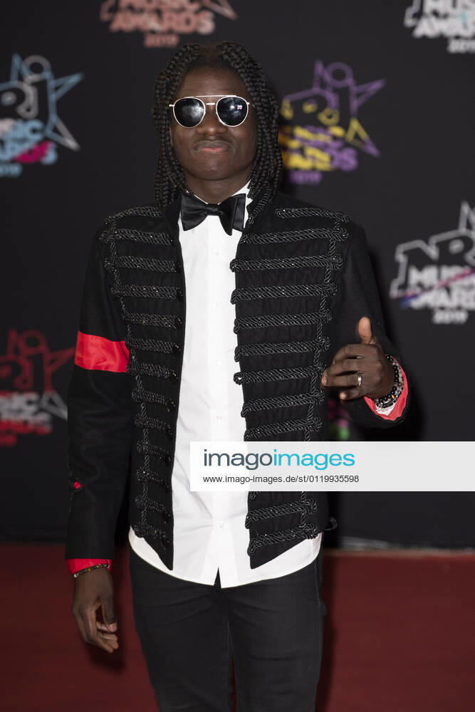 Salif Gueye, alias Salif la Source, on the red carpet before the 2019 NRJ Music Awards ceremony Salif Gueye, alias Salif la Source, on the red carpet before the 2019 NRJ Music Awards ceremony in Cannes (south-eastern France), at the Palais des Festivals convention center on 2019 11 09 Alpes Maritimes 06; Cannes; PACA; Provence Alpes Cote d Azur Europe; Western Europe; France