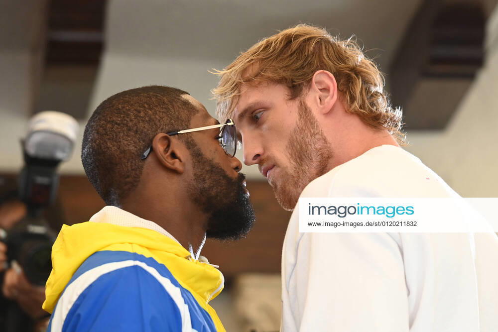 MIAMI BEACH, FL - JUNE 03: Floyd Mayweather and Logan Paul face off during media availability ahead of their June 6th exhibition boxing match at Villa Casa Casuarina at the former Versace Mansion on June 03, 2021 in Miami Beach Florida.