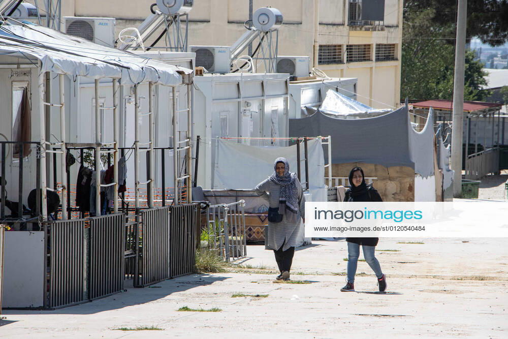 New Concrete Walls Around Diavata Refugee Camp In Greece Greece is building new concrete walls around the refugee camps across the country in the mainland and the islands. The 3meter wall was a decision by the Greek Ministry of Migration and European Commission. Asylum seekers feel like imprisonment conditions while the authorities claim its for their own security, monitoring the entrance and locking the camp during the night. Diavata refugee and migrant camp is a former military camp near the city of Thessaloniki in Northern Greece. The concrete fortification called enhanced fence has been built around the whole area of the camp. Diavata, Greece on June 6, 2021 Thessaloniki Greece economou-notitle210605_npyqI
