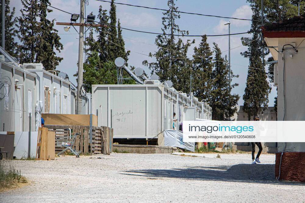 New Concrete Walls Around Diavata Refugee Camp In Greece Greece is building new concrete walls around the refugee camps across the country in the mainland and the islands. The 3meter wall was a decision by the Greek Ministry of Migration and European Commission. Asylum seekers feel like imprisonment conditions while the authorities claim its for their own security, monitoring the entrance and locking the camp during the night. Diavata refugee and migrant camp is a former military camp near the city of Thessaloniki in Northern Greece. The concrete fortification called enhanced fence has been built around the whole area of the camp. Diavata, Greece on June 6, 2021 Thessaloniki Greece economou-notitle210605_npkTU