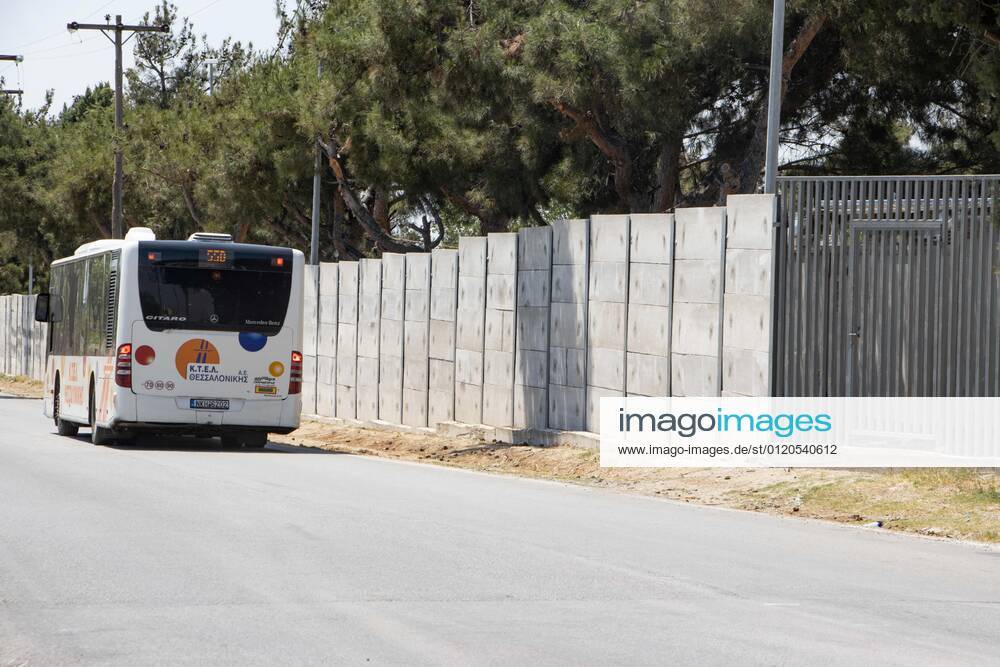 New Concrete Walls Around Diavata Refugee Camp In Greece Greece is building new concrete walls around the refugee camps across the country in the mainland and the islands. The 3meter wall was a decision by the Greek Ministry of Migration and European Commission. Asylum seekers feel like imprisonment conditions while the authorities claim its for their own security, monitoring the entrance and locking the camp during the night. Diavata refugee and migrant camp is a former military camp near the city of Thessaloniki in Northern Greece. The concrete fortification called enhanced fence has been built around the whole area of the camp. Diavata, Greece on June 6, 2021 Thessaloniki Greece economou-notitle210605_npySf