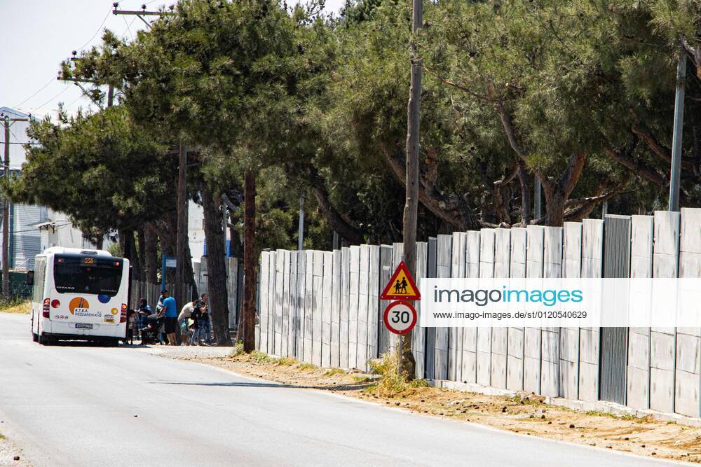 New Concrete Walls Around Diavata Refugee Camp In Greece Greece is building new concrete walls around the refugee camps across the country in the mainland and the islands. The 3meter wall was a decision by the Greek Ministry of Migration and European Commission. Asylum seekers feel like imprisonment conditions while the authorities claim its for their own security, monitoring the entrance and locking the camp during the night. Diavata refugee and migrant camp is a former military camp near the city of Thessaloniki in Northern Greece. The concrete fortification called enhanced fence has been built around the whole area of the camp. Diavata, Greece on June 6, 2021 Thessaloniki Greece economou-notitle210605_npazc