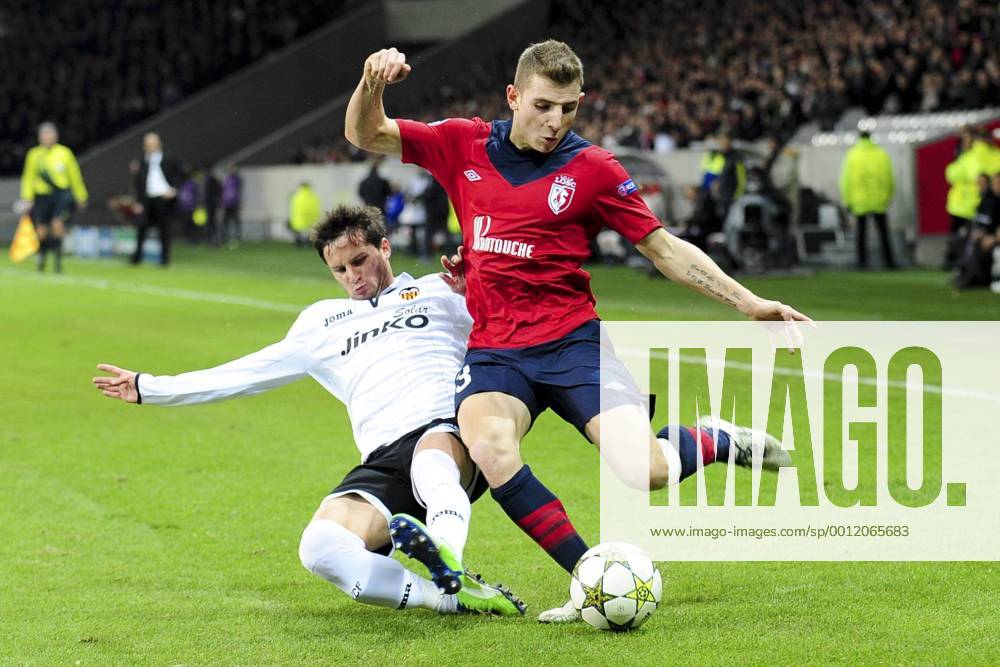 Lucas Digne (Losc) vs Pablo Piatti (Fc Valence) FOOTBALL : Lille vs Fc Valence - Ligue des Champions - 05 12 2012 JBAutissier Panoramic