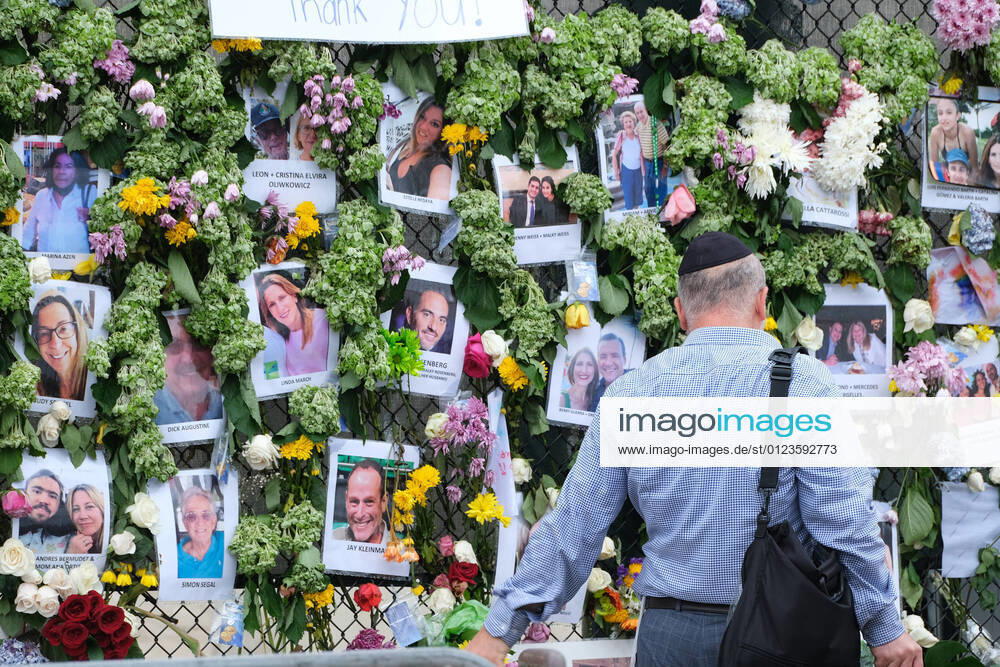 People pay their respects at a make-shift memorial for victims of a partial building collapse, outside St. Joseph Catholic Church in Surfside, Florida on Wednesday, June 30, 2021. News reports said that 16 people have died and over 147 others were missing in the collapse. MIA20210630130 GARYxIxROTHSTEIN