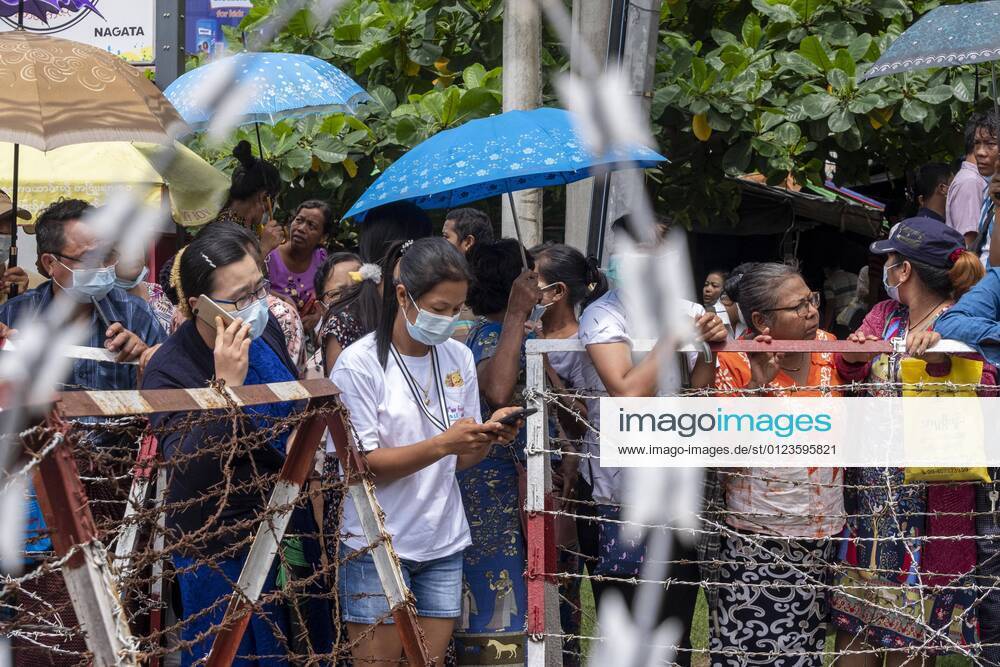 Relatives wait in front of Insein prison for the release of prisoners who were arrested since the February military coup. .Myanmar s military detained State Counsellor of Myanmar Aung San Suu Kyi on February 01, 2021 and declared a state of emergency while seizing the power in the country for a year after losing the election against the National League for Democracy Yangon Myanmar - ZUMAs197 20210630_zaa_s197_095
