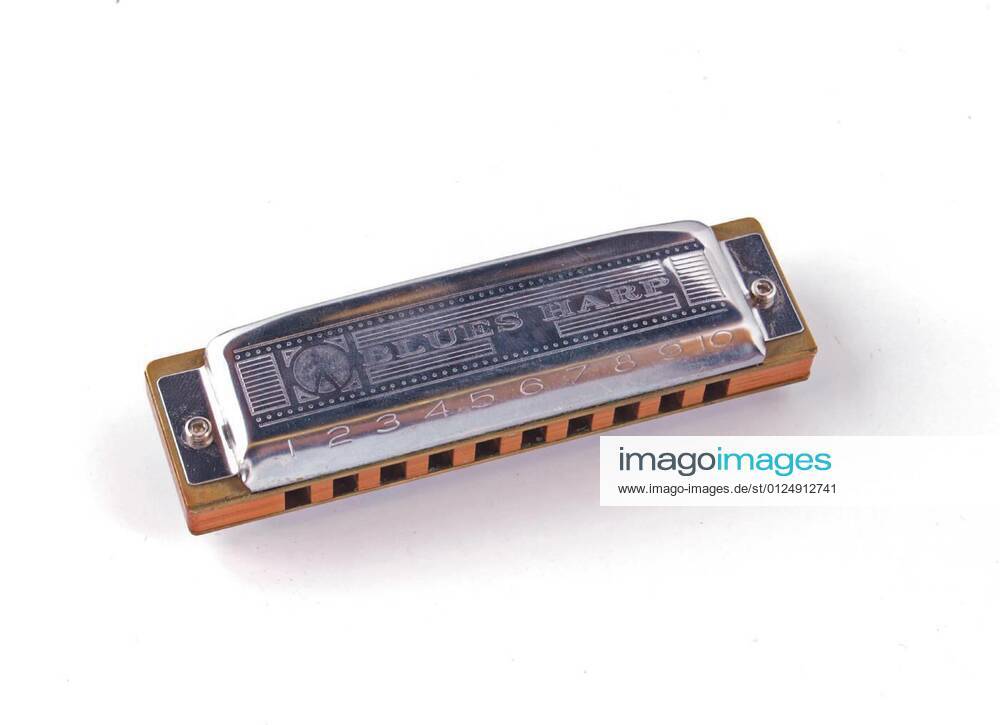 Harmonica or mouth organ on a white background, 28.07.2010 20:50:21,
