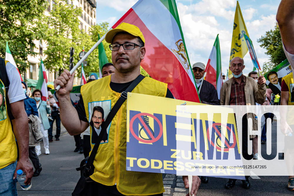 Iranian exiles and supporters of the National Council of Resistance of Iran NCRI protest against the Iranian government in Berlin The demonstrators demand more human rights and the abolition of the death penalty snapshot photography M Czapski