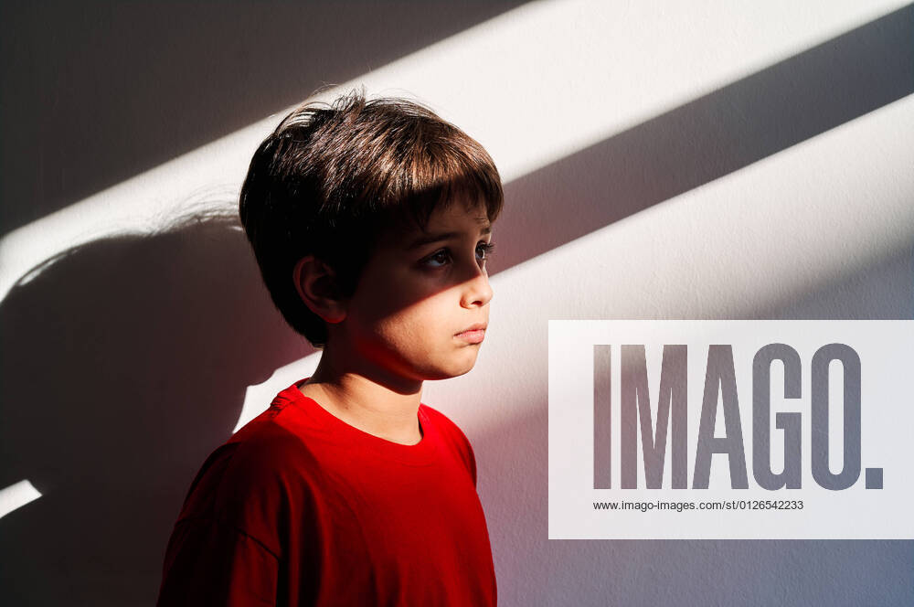 Side view of sad helpless lonely preteen boy with bruises on face suffering from domestic violence, Model released AdalbertoRodriguez_ChildAbuse_41.jpg