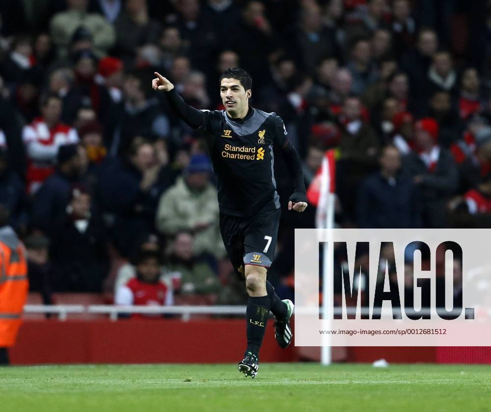 Liverpool s Luis Suarez celebrates scoring his sides opening goal.. - FC Arsenal vs FC Liverpool - Barclays Premier League - Emirates Stadium, London- 30 01 13 - .