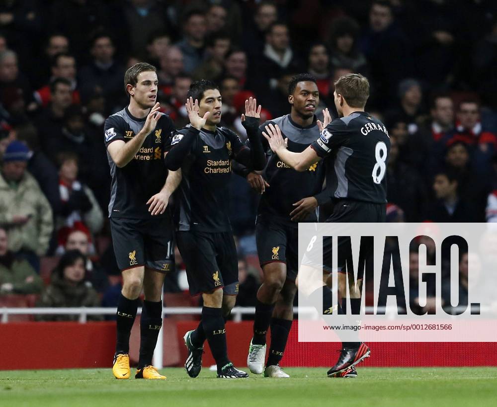 Liverpool s Luis Suarez celebrates scoring his sides opening goal.. - FC Arsenal vs FC Liverpool - Barclays Premier League - Emirates Stadium, London- 30 01 13 - .
