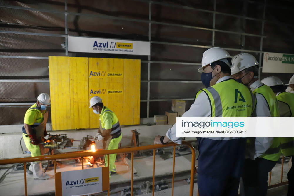 The president of the Junta de Andalucia, Juanma Moreno (c), attends the first welding of the track rail at the Atarazanas metro station. On 26 July 2021, in Malaga (Andalusia, Spain). 26 JULY 2021;PIXELATED Ãlex Zea LagenciaEP 07 26 2021 Malaga (Andalusia) Malaga (Andalusia) Spain