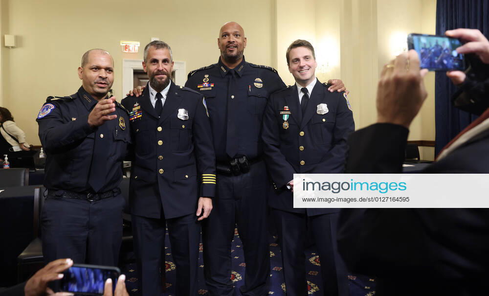 (L-R) Sgt. Aquilino Gonell of the US Capitol Police, Officer Michael Fanone of the DC Metropolitan Police, Private First Class Harry Dunn of the US Capitol Police and Officer Daniel Hodges of the DC Metropolitan Police pose for a photo after testifying before members of the Select Committee to Investigate the January 6th Attack on the US Capitol, including Chairman and Democratic Representative from Mississippi Bennie Thompson, during their first hearing in the Cannon House Office Building on Capitol Hill in Washington, DC, USA, 27 July, 2021. The committee will hear testimony from members of the US Capitol Police and the Metropolitan Police Department who tried to protect the Capitol ag - ZUMAs152 20210727_zaa_s152_427