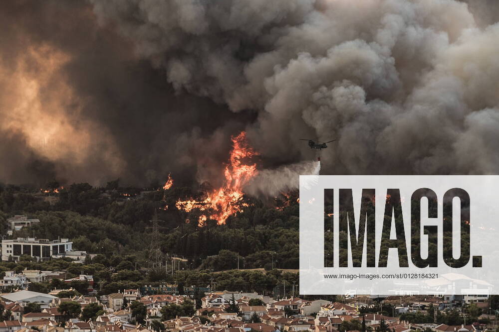 Flames burn near buildings in Tatoi area, northern Athens. Athens Greece - ZUMAe114 20210803_zaa_e114_014