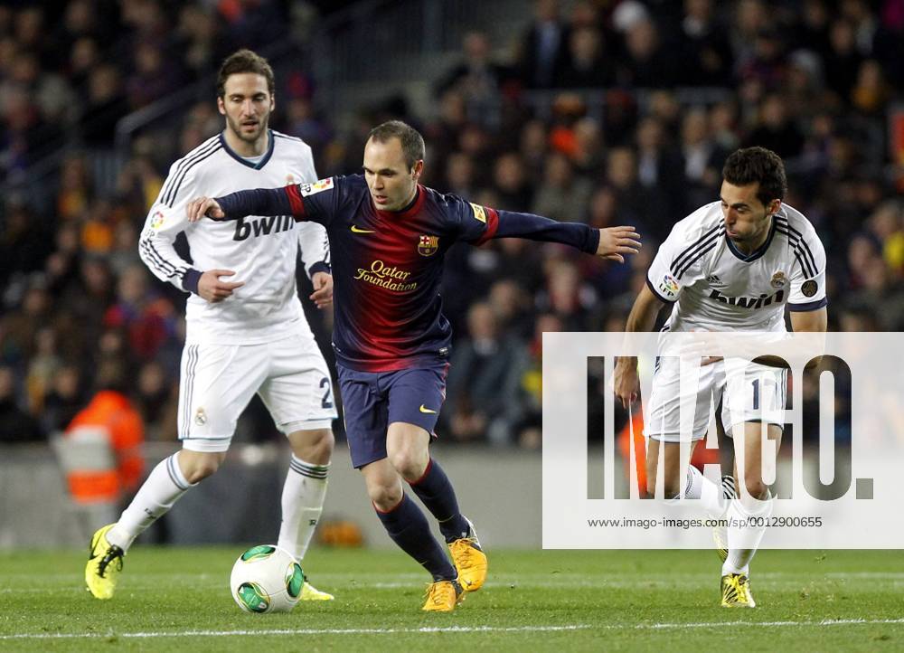 Copa del Rey. FC Barcelona vs Real Madrid. Andres Iniesta with Gonzalo Higuain and Alvaro Arbeloa..