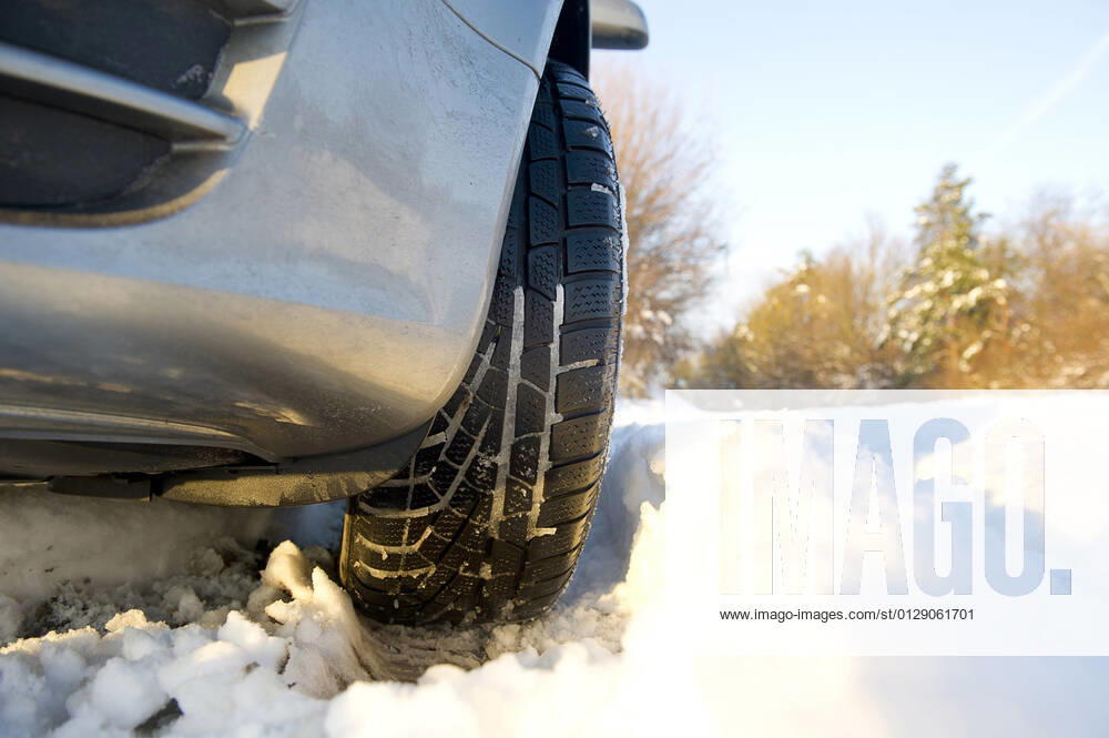 Car with winter tires in the snow, Germany car with winter tires in the snow , Germany BLWS649101