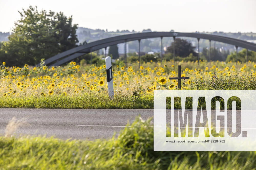 A cross at the roadside commemorates a victim of road traffic 12 08 2021 Germany, Baden Württemberg, Rottenburg am Neckar