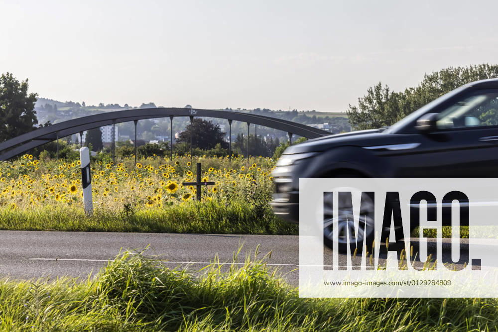 A cross at the roadside commemorates a victim of road traffic 12 08 2021 Germany, Baden Württemberg, Rottenburg am Neckar